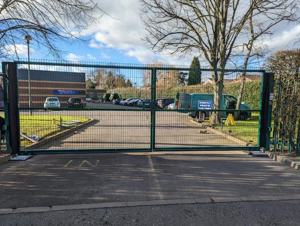School entrance gate in green.